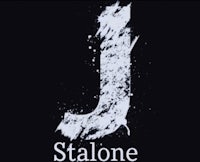 the letter j is painted on a black background