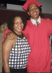a group of people posing for a photo in a graduation gown