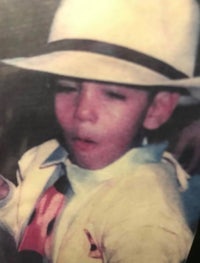a photo of a young boy in a hat