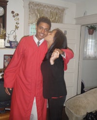 a woman wearing a graduation gown