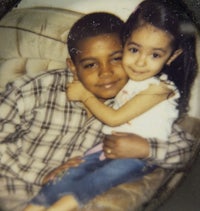 a photo of a boy and a girl hugging each other