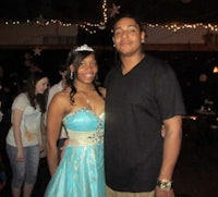 a man and woman posing for a picture at a party