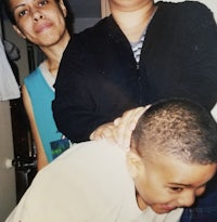 two women and a boy posing for a photo